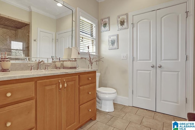 bathroom with tile patterned flooring, vanity, toilet, and ornamental molding