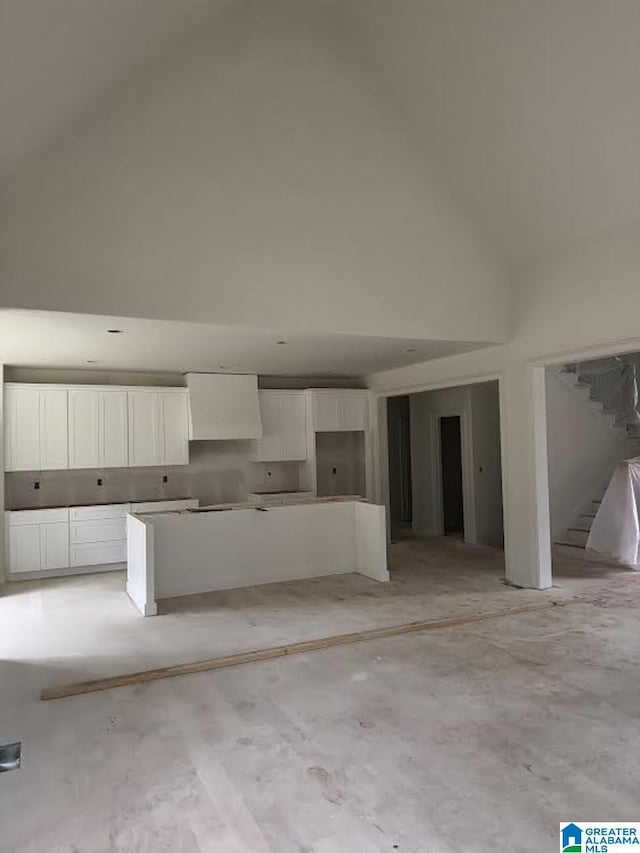 kitchen featuring white cabinetry and exhaust hood