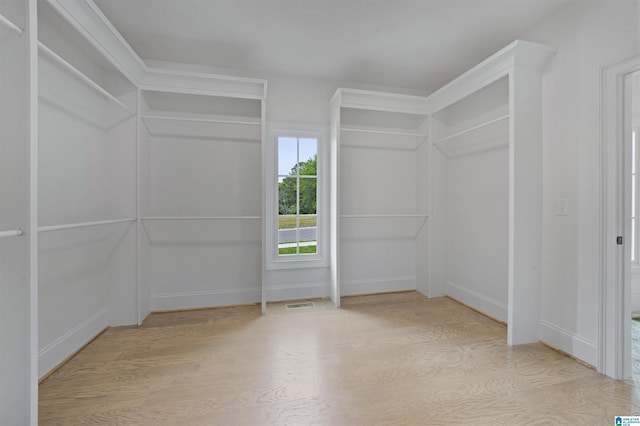 walk in closet featuring visible vents and light wood-type flooring