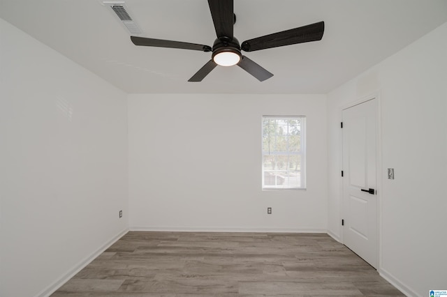 unfurnished room featuring light wood-type flooring and ceiling fan