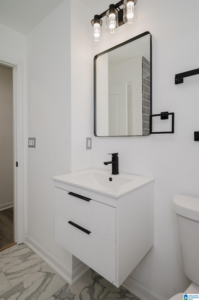 bathroom with vanity and toilet