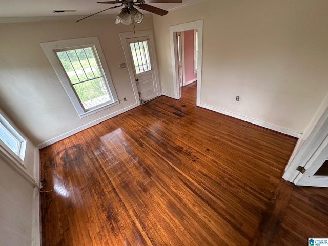 foyer with ceiling fan, vaulted ceiling, and hardwood / wood-style floors