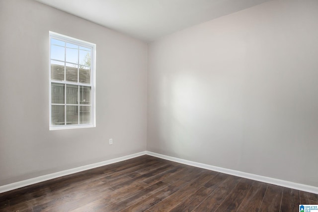 spare room featuring dark hardwood / wood-style floors