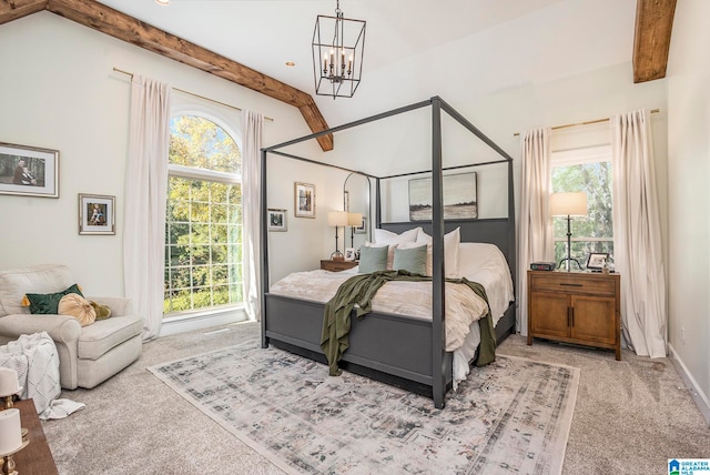 carpeted bedroom with vaulted ceiling with beams and a notable chandelier