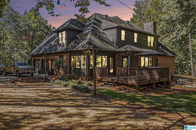 view of front of property featuring a wooden deck