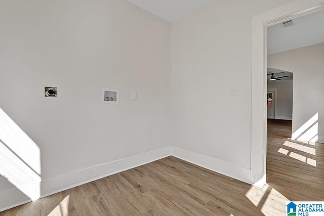 clothes washing area featuring hardwood / wood-style floors, electric dryer hookup, washer hookup, and ceiling fan