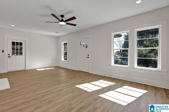 entryway featuring light hardwood / wood-style floors, a wealth of natural light, and ceiling fan