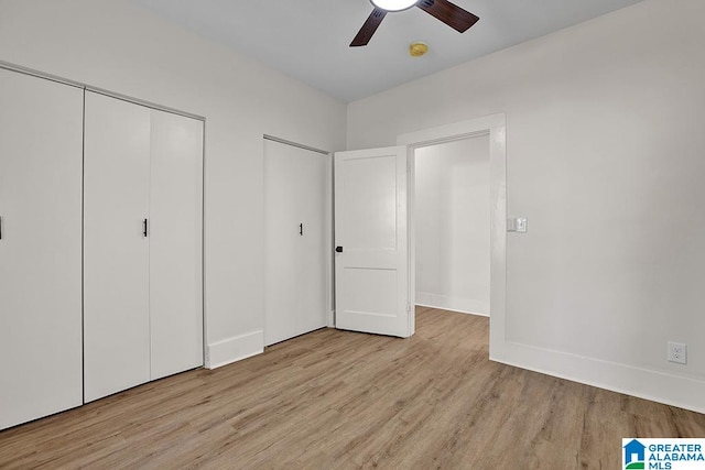 unfurnished bedroom with light hardwood / wood-style floors and ceiling fan