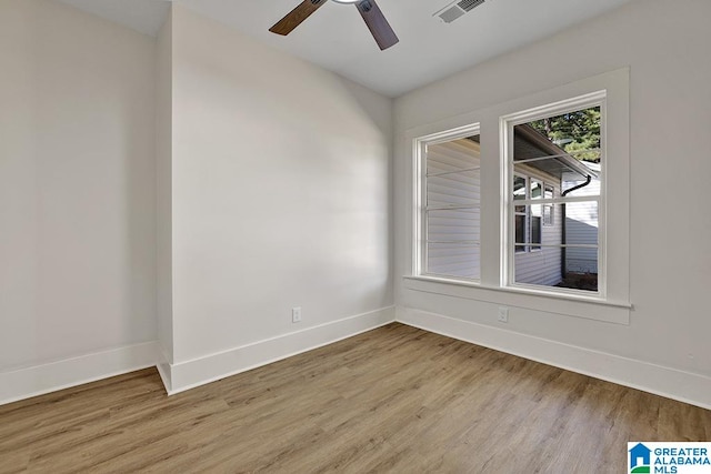 unfurnished room featuring light hardwood / wood-style floors and ceiling fan