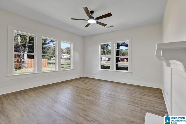 interior space featuring wood-type flooring and ceiling fan