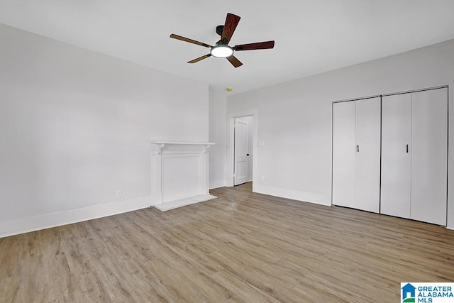 unfurnished bedroom featuring a closet, ceiling fan, and light hardwood / wood-style floors