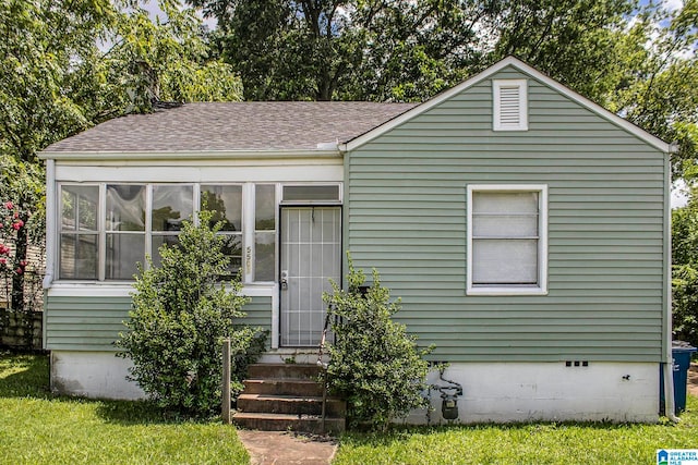 view of front of house featuring a sunroom