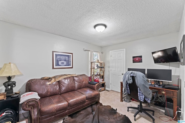 carpeted home office with a textured ceiling