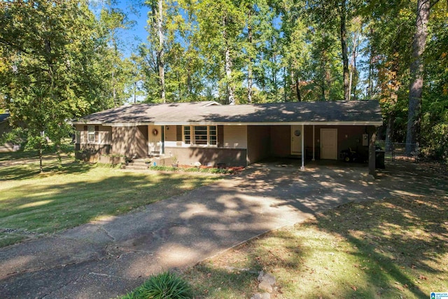 ranch-style home featuring a front yard and a carport