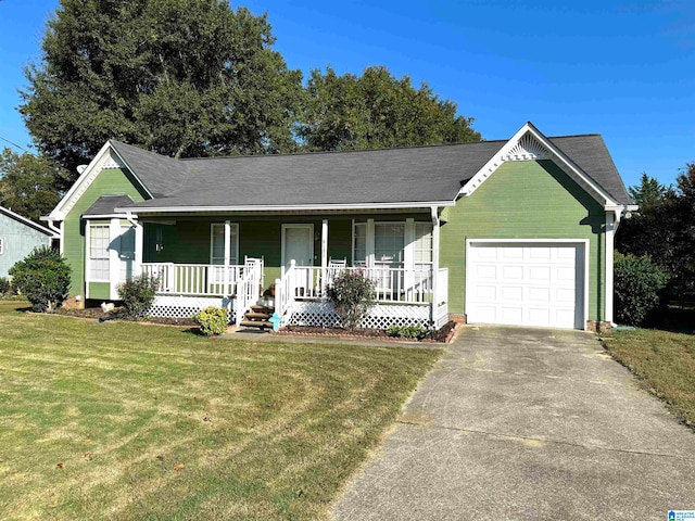 view of front of property with a porch, a front yard, and a garage