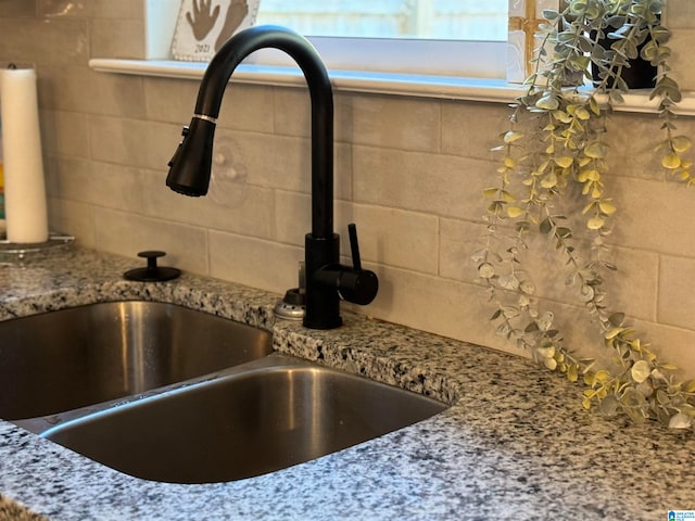 interior details with sink and stone countertops