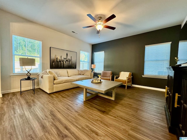 living room with ceiling fan and wood-type flooring