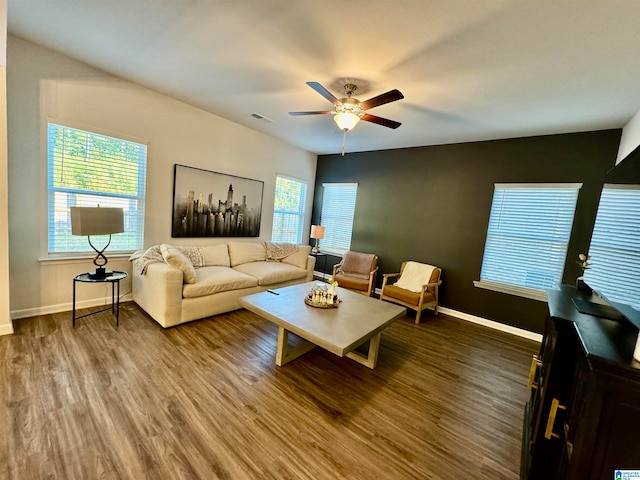 living room with wood-type flooring and ceiling fan