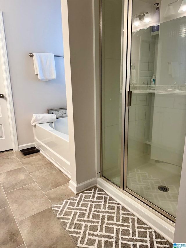 bathroom with shower with separate bathtub