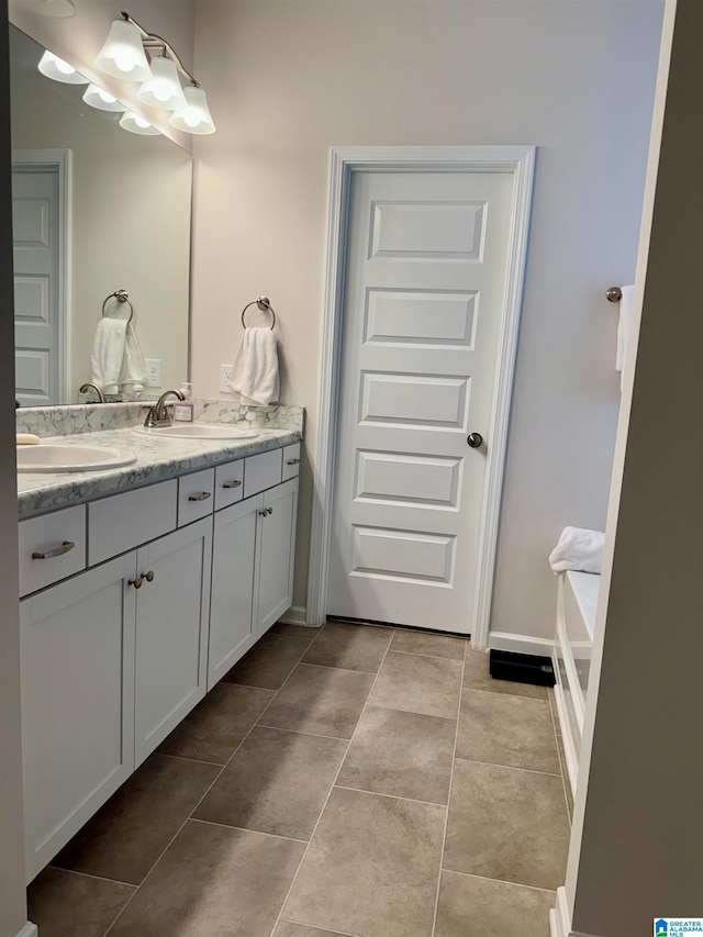 bathroom with vanity and tile patterned floors