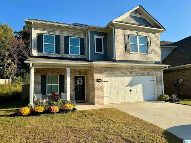 view of front of property featuring a front lawn and a garage