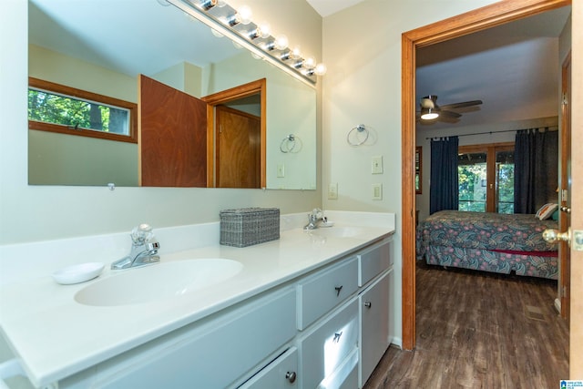 bathroom featuring vanity, ceiling fan, wood-type flooring, and plenty of natural light