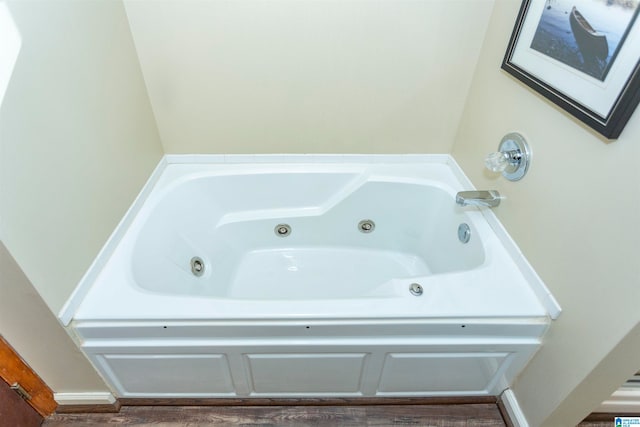 bathroom featuring a washtub