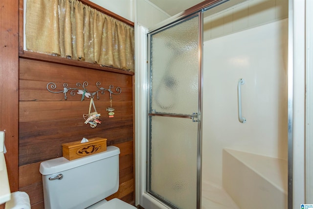 bathroom featuring toilet and walk in shower