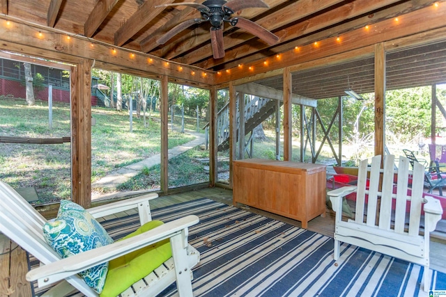 sunroom with a wealth of natural light and ceiling fan