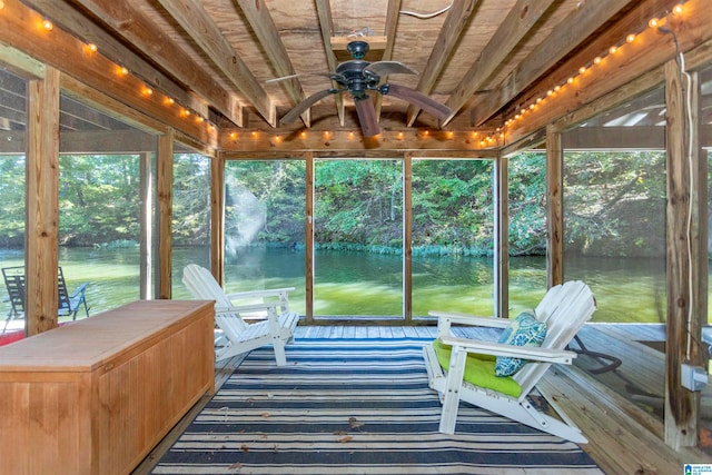 sunroom featuring ceiling fan