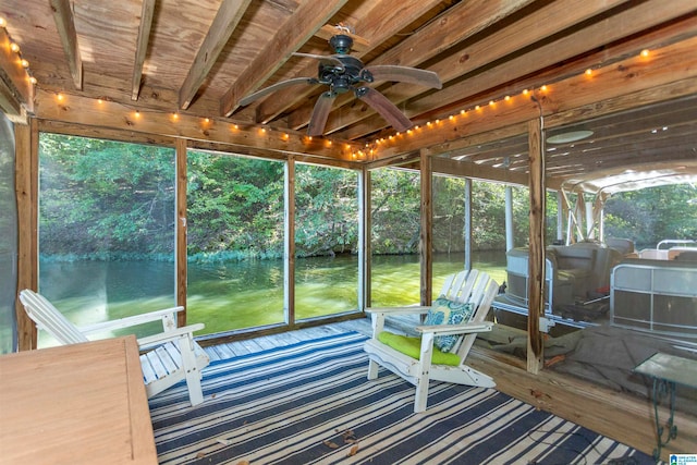 sunroom featuring ceiling fan and a wealth of natural light