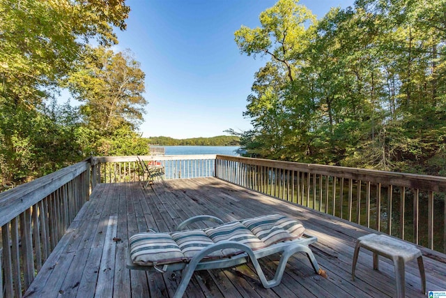 wooden deck with a water view