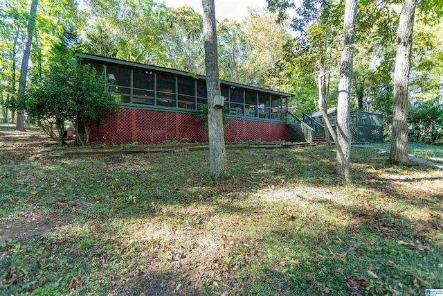 view of yard with a sunroom