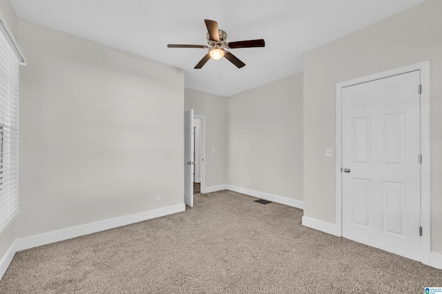 unfurnished bedroom featuring carpet and ceiling fan