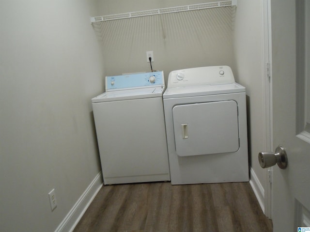 washroom with washer and dryer and dark hardwood / wood-style flooring