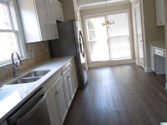 kitchen featuring white cabinetry, stainless steel appliances, pendant lighting, and plenty of natural light