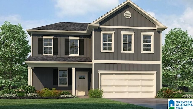 view of front of property featuring a garage and a front yard