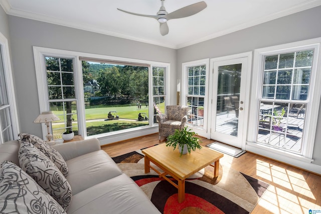 sunroom featuring ceiling fan