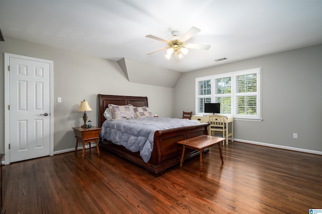 bedroom with dark wood-type flooring, vaulted ceiling, and ceiling fan