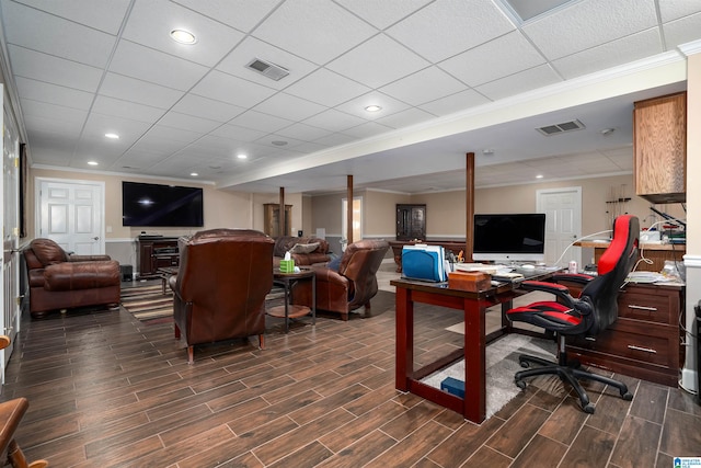 home office with crown molding, a paneled ceiling, and dark wood-type flooring