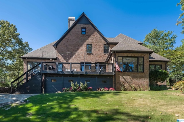 rear view of house featuring a lawn