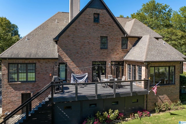 back of house with a wooden deck