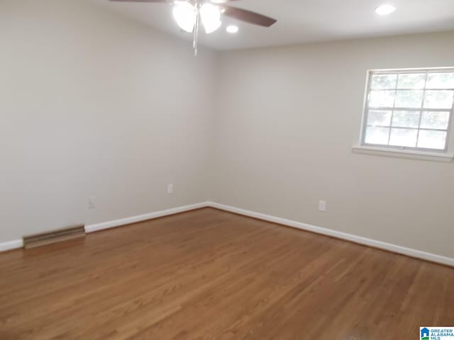 empty room featuring ceiling fan and wood-type flooring