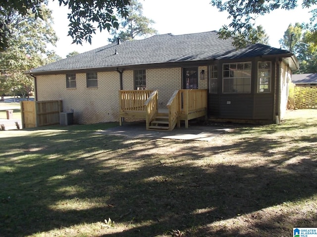 rear view of house with a lawn