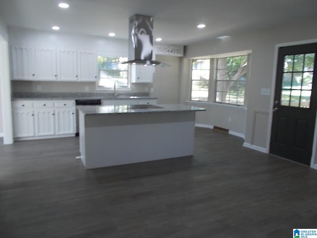 kitchen featuring white cabinetry, island exhaust hood, dark wood-type flooring, and a center island