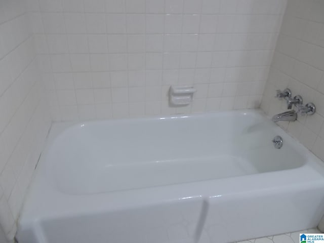 bathroom featuring a tub to relax in