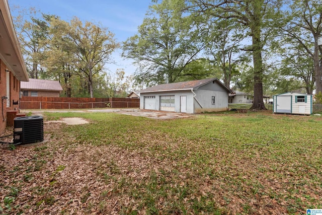 view of yard with cooling unit and a storage shed