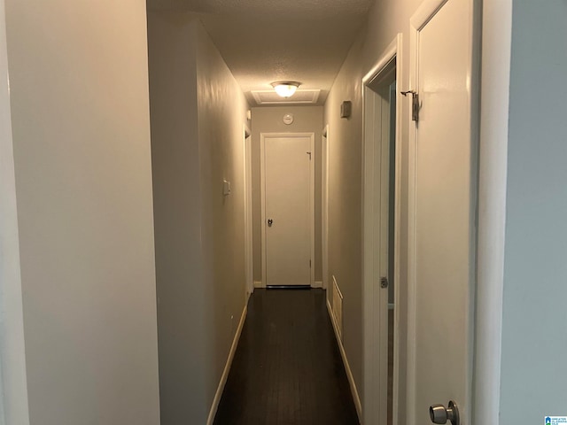 hallway featuring a textured ceiling