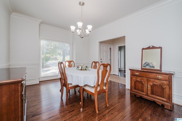 dining room featuring crown molding, a chandelier, and dark wood-type flooring