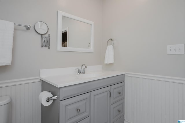 bathroom featuring toilet and vanity